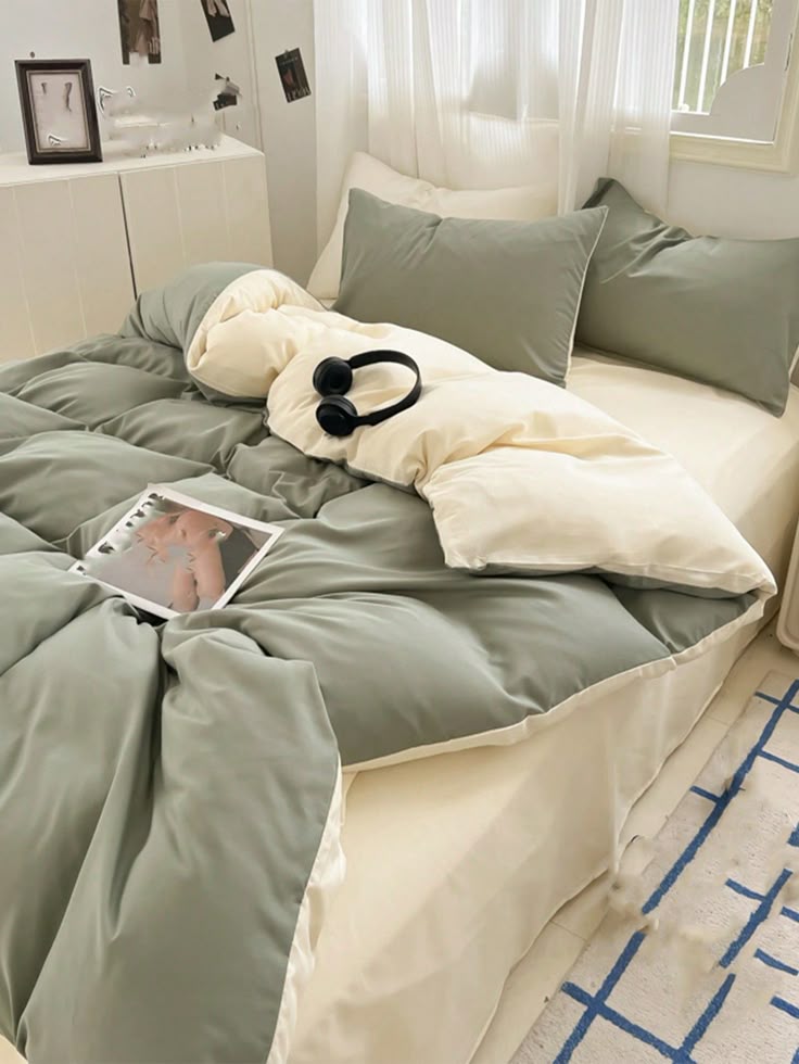 Cozy modern bedroom with green bedding and soft lighting. Ideal for contemporary design inspiration.